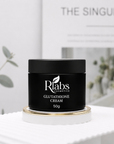 Black jar of Rlabs Glutathione Cream on a white surface with a blurred background